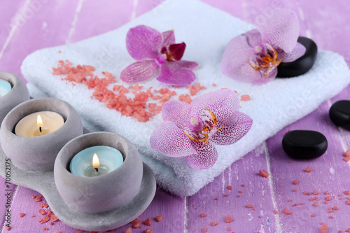 Orchid flowers, spa stones, candles and towel