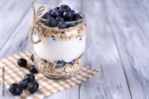 Healthy breakfast - yogurt with blueberries and muesli served