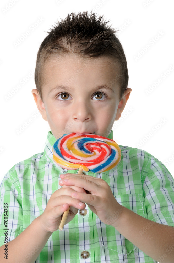 Blond boy with lollipop in her mouth