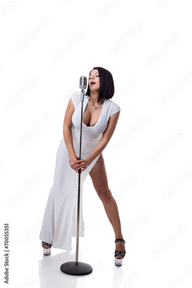 Gorgeous busty singer posing with microphone