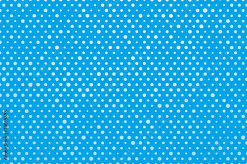 blue background with white polka dots