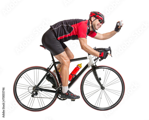 cheerful cyclist photographing himself on a bike