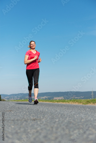 Erwachsene Frau beim Joggen