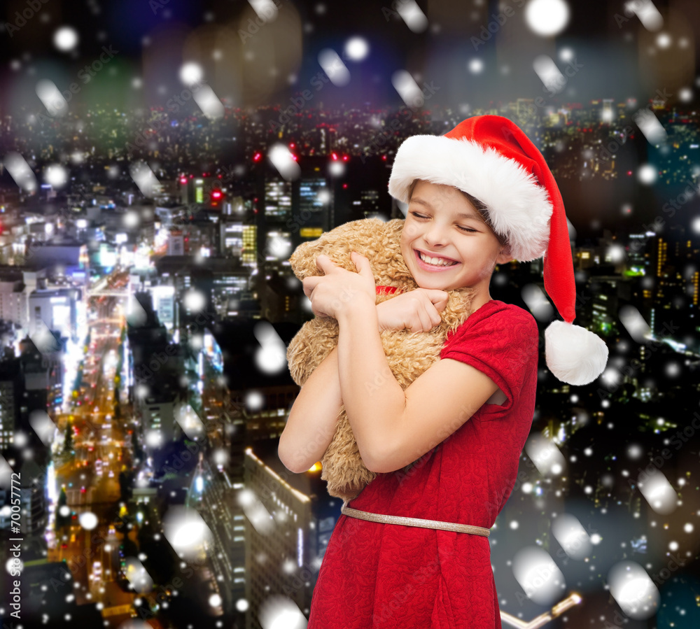 smiling girl in santa helper hat with teddy bear smiling girl in santa helper hat with teddy bear