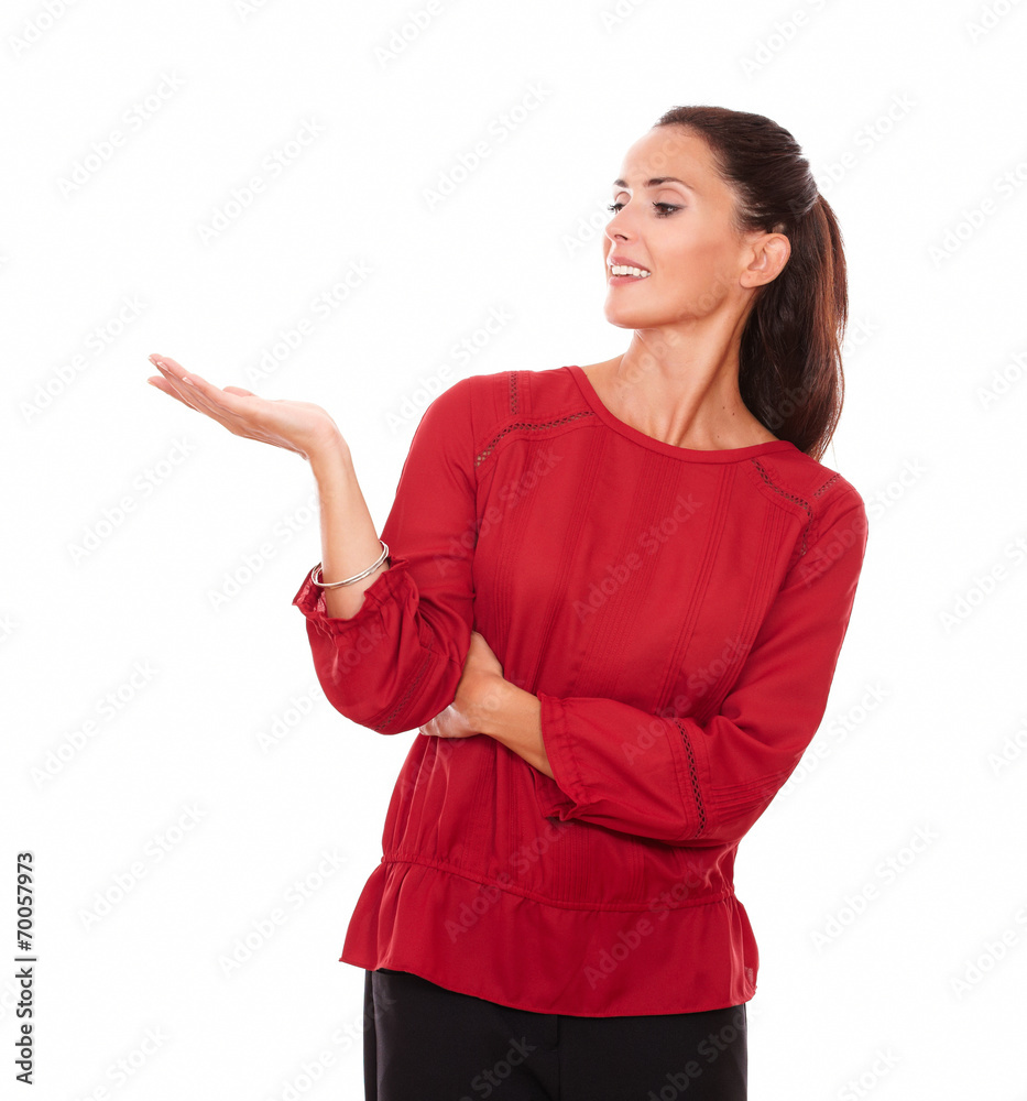 Lovely hispanic lady holding her right palm up Lovely hispanic lady holding her right palm up