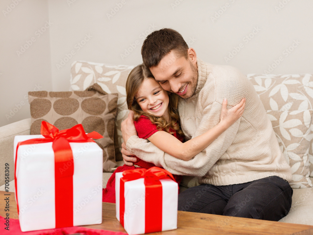 smiling father and daughter hugging smiling father and daughter hugging