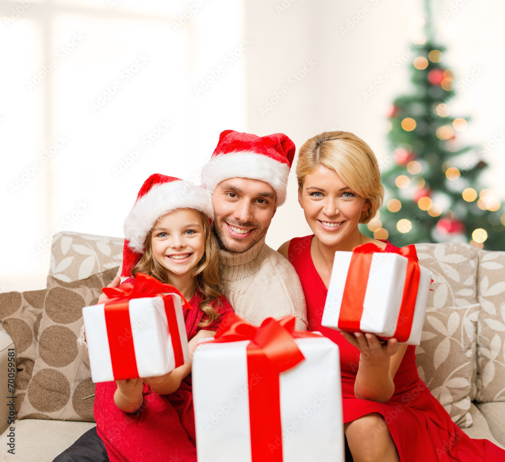 smiling family giving many gift boxes smiling family giving many gift boxes