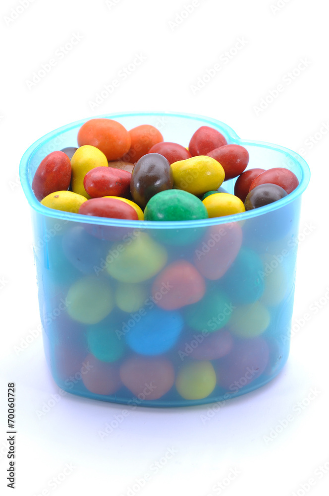 Various Color Of Chocolate Beans In Plastic Container Various Color Of Chocolate Beans In Plastic Container