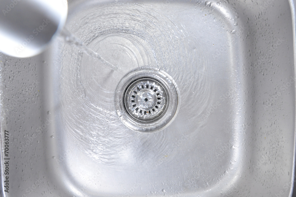 Water Flowing Down In The Hole In A Kitchen Sink Water Flowing Down In The Hole In A Kitchen Sink