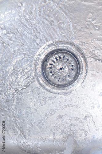 Water Flowing Down In The Hole In A Kitchen Sink 