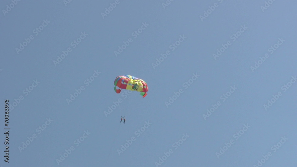 Summer holiday scenics at the beach Parasailing and water sports Summer holiday scenics at the beach Parasailing and water sports