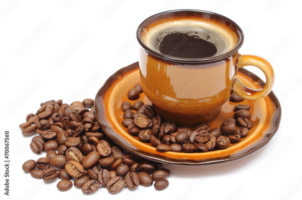 Fototapeta premium Heap of coffee grains and cup of beverage