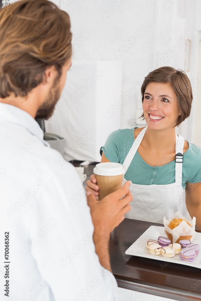Pretty waitress serving happy customer Pretty waitress serving happy customer