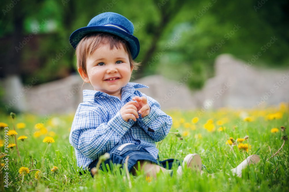 beautiful cheerful boy with hat in summer park beautiful cheerful boy with hat in summer park