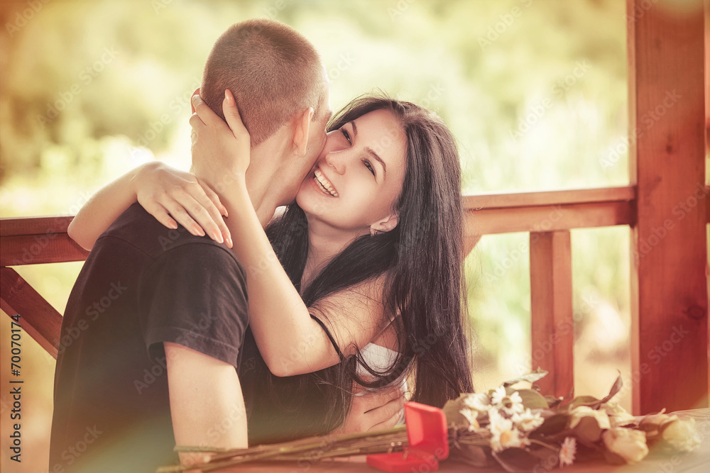 Fototapeta premium Love and affection between a young couple at the park