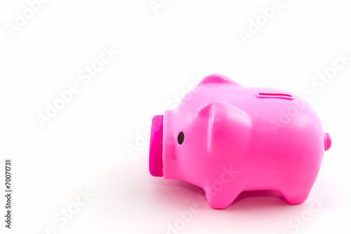 Pink piggy bank saving.