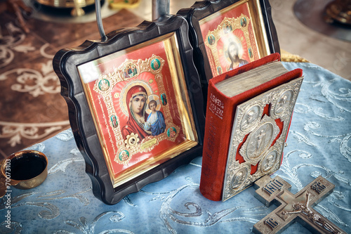 Holy Bible and Orthodox icons prepared for wedding ceremony