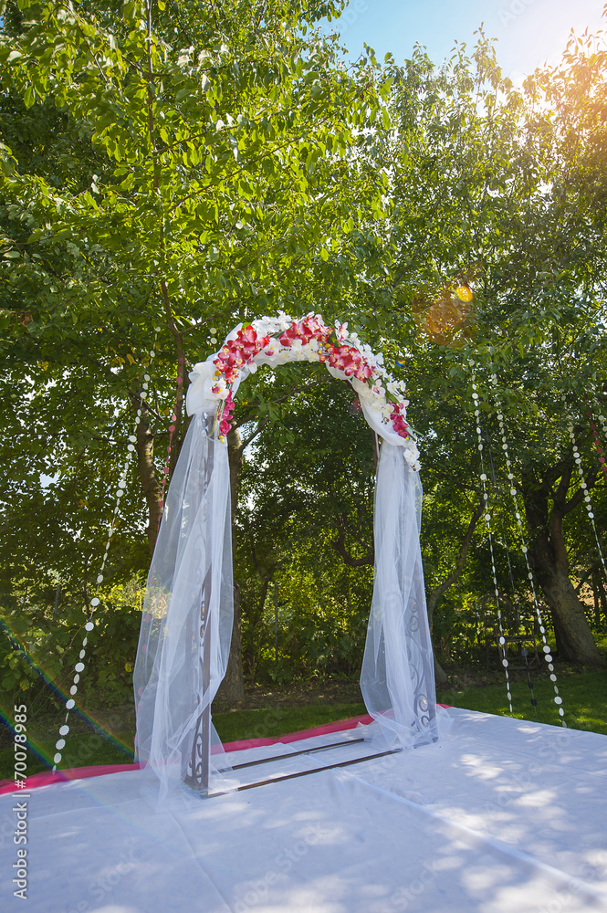 Fototapeta premium Arch for the wedding ceremony. Floristic composition in vintage
