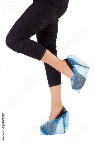 Female legs in overshoes