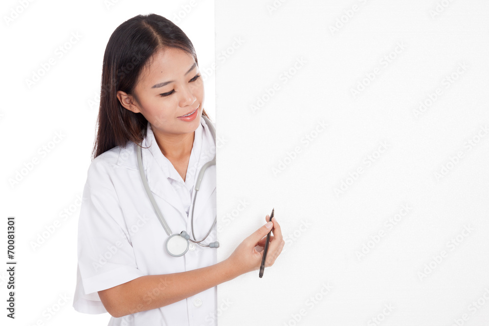 Young Asian female doctor behind blank sign point with a pen Young Asian female doctor behind blank sign point with a pen