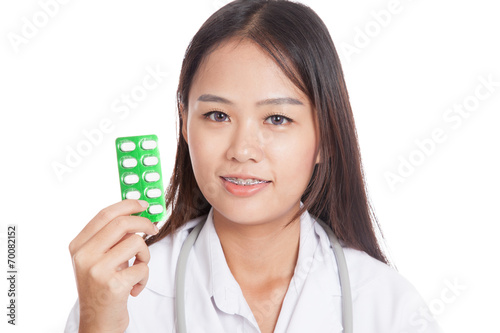 Young Asian female doctor smile with Blister pack of tablets