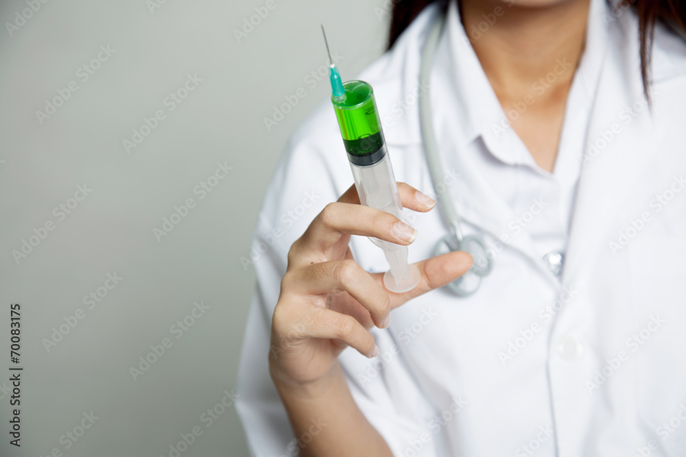 Close up young Asian female doctor with syringe Close up young Asian female doctor with syringe