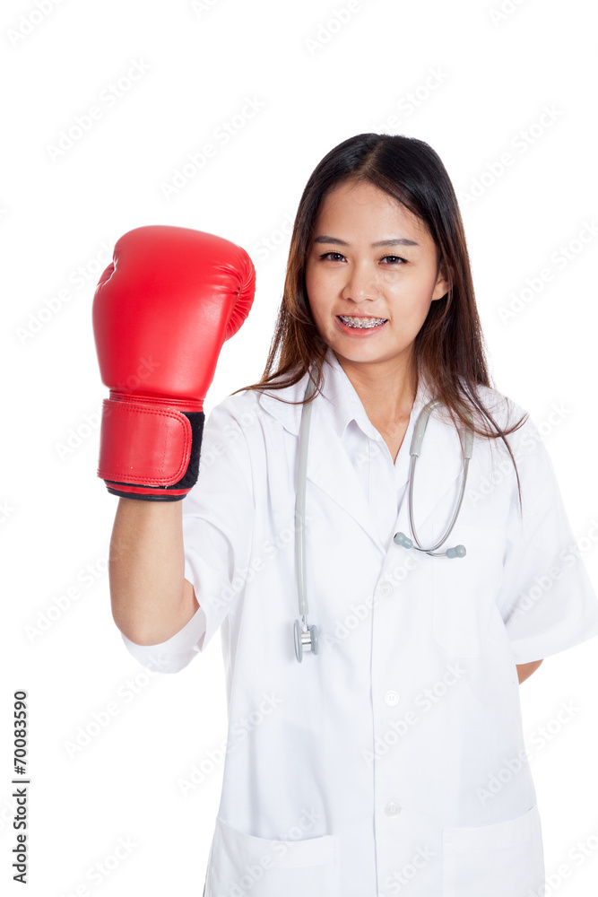 Young Asian female doctor with boxing glove Young Asian female doctor with boxing glove