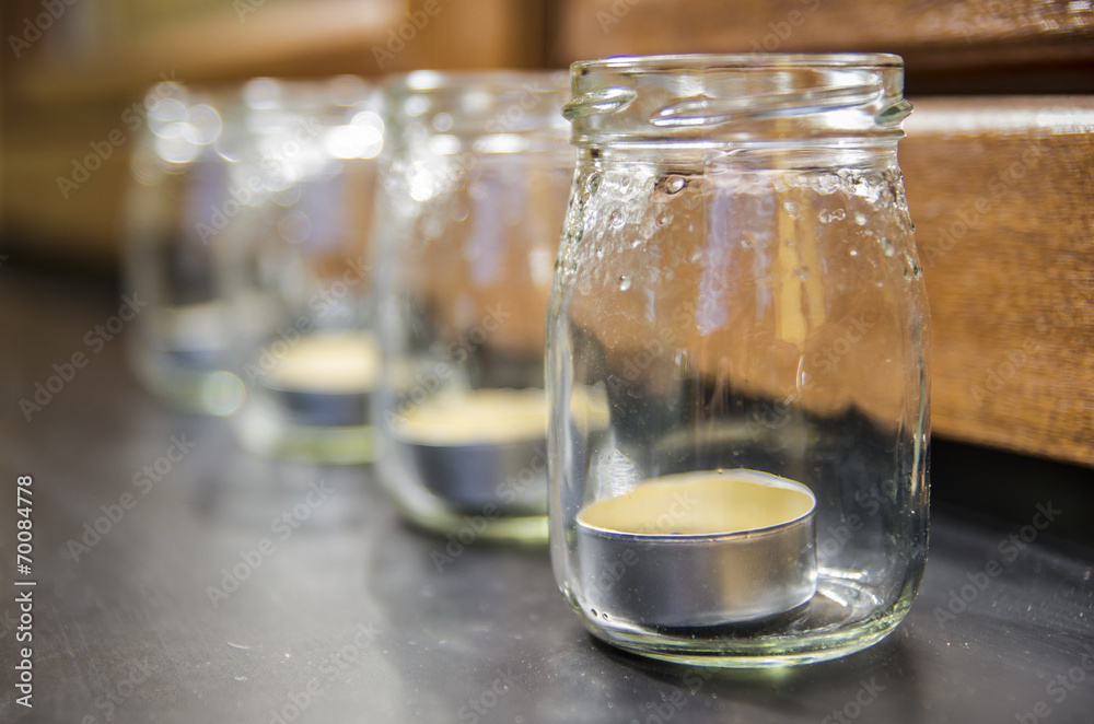 Candles in jars on the windowsill Candles in jars on the windowsill