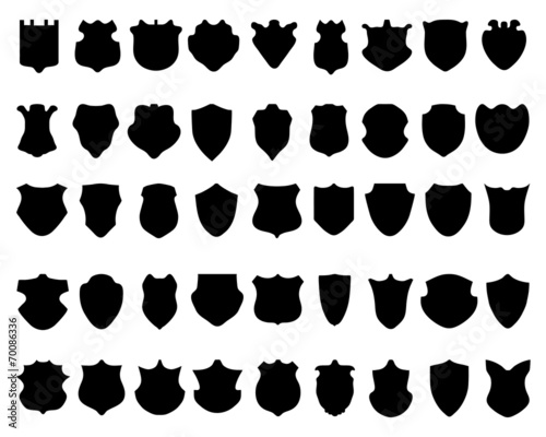 Black silhouettes of shields on white a background, vector