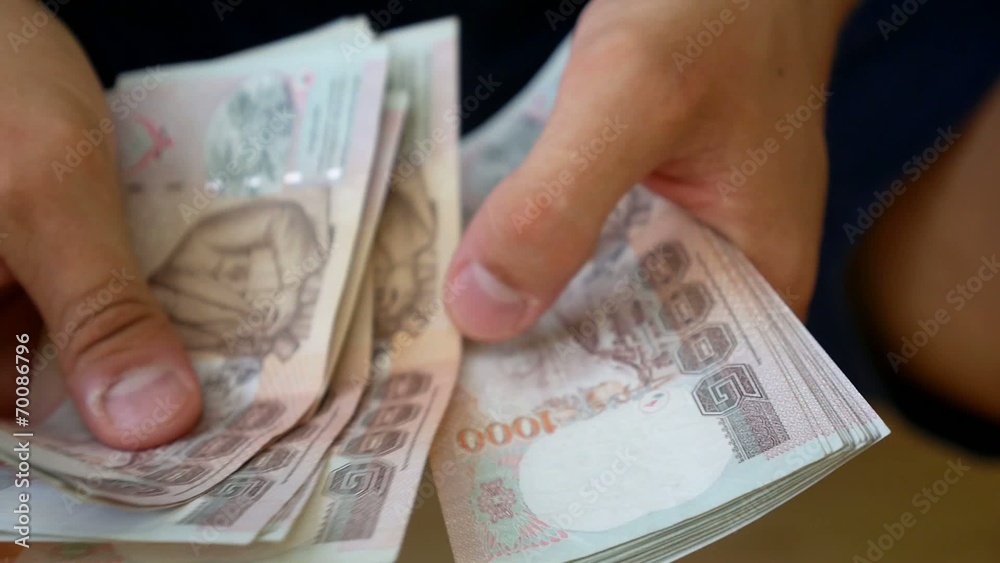 Businessman Counts Money in Hands.