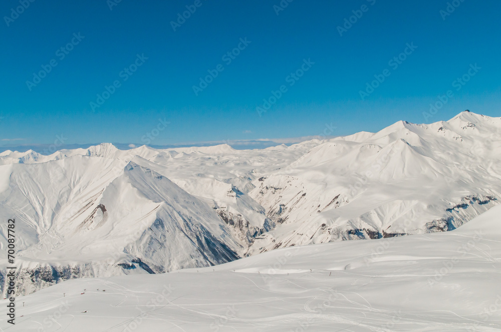 Snow mountains on bright winter day