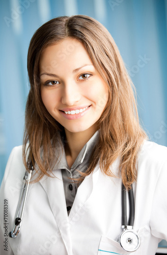 Cheerful female doctor at office