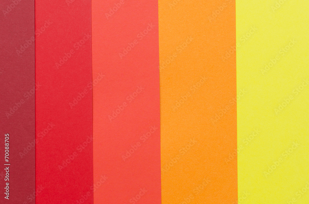 warm-colored construction paper sheets arranged vertically warm-colored construction paper sheets arranged vertically