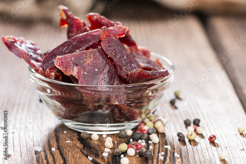 Photos Beef Jerky on wooden background