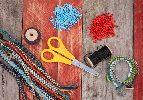 bead making accessories on grunge wood background