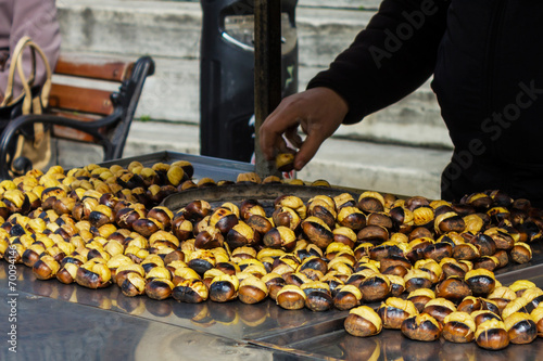 Closeup of chestnuts being roasted