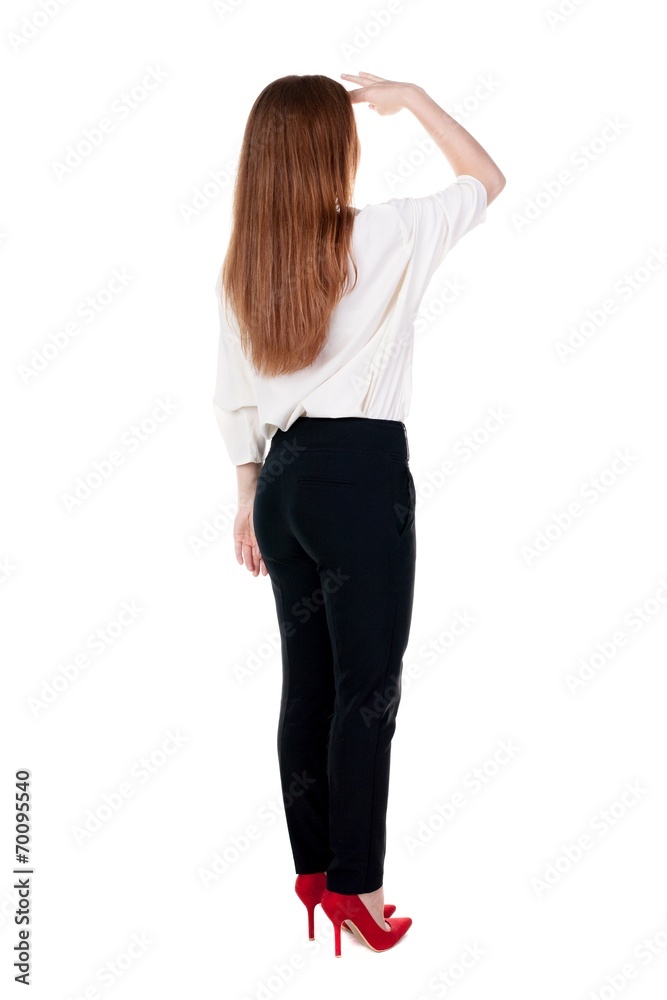 Fototapeta premium back view of redhead business woman contemplating.