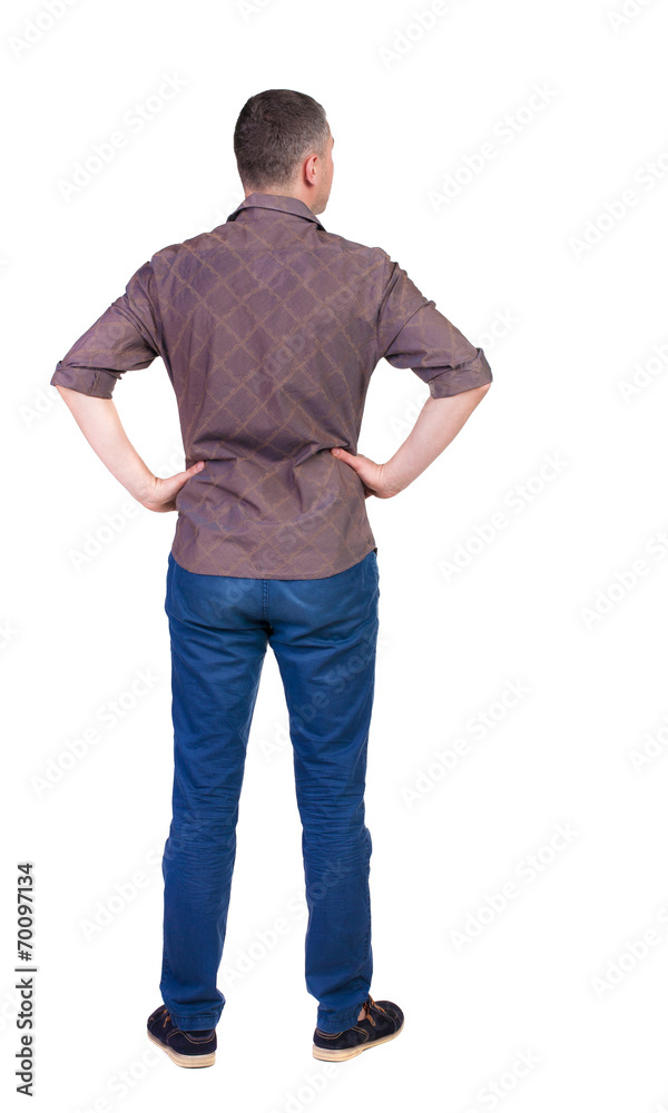 Back view of handsome man in shirt looking up. Back view of handsome man in shirt looking up.