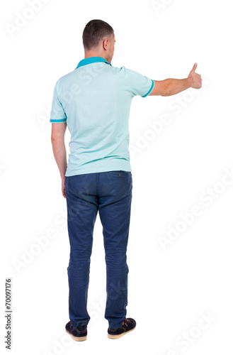 Back view of man in checkered shirt shows thumbs up.