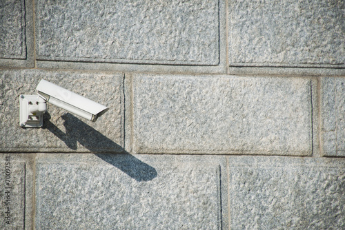 Security camera attached to the wall