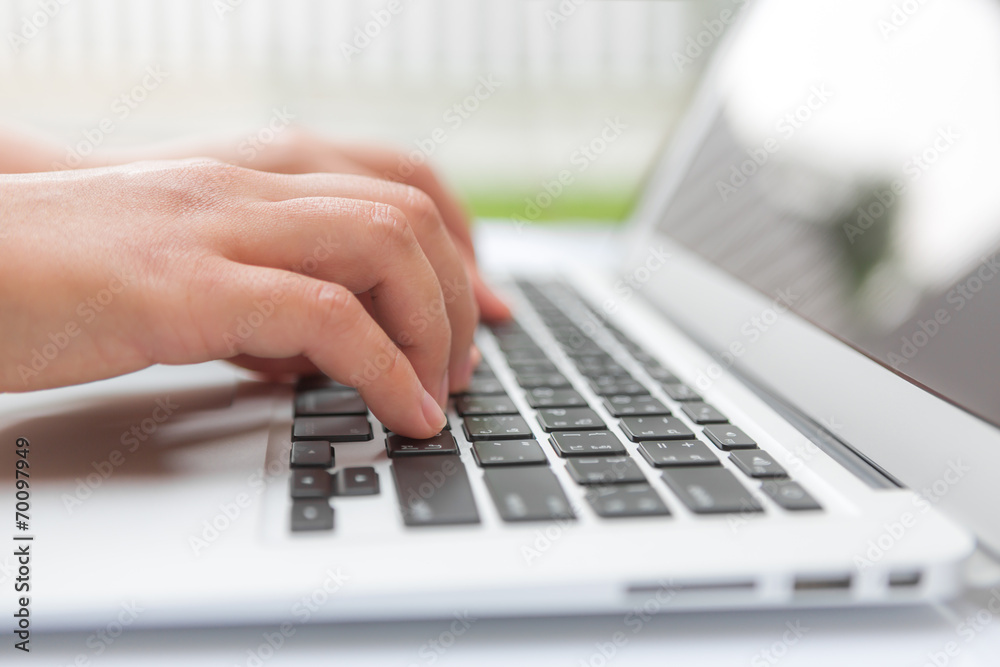 Closeup of business woman hand typing on laptop keyboard Closeup of business woman hand typing on laptop keyboard