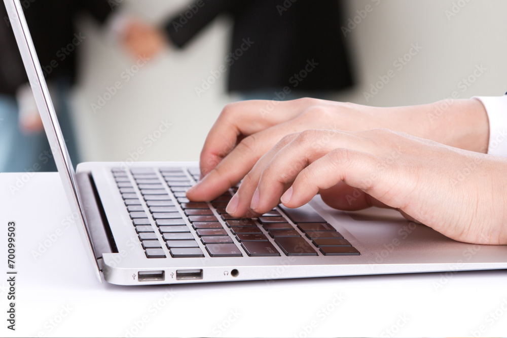 Closeup of business woman hand typing on laptop keyboard Closeup of business woman hand typing on laptop keyboard