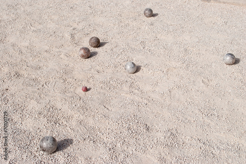 Metallic petanque balls and a small red jack