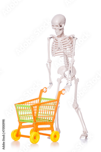 Skeleton with shopping cart trolley isolated on white © Elnur