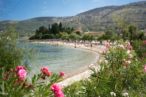 Fototapeta Naklejka Na Ścianę i Meble -  Beach at Vis Island, Croatia, Franciscan Church and Monastery