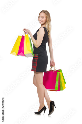 Woman after shopping spree on white