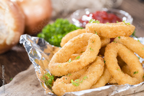 Onion Rings on wooden background