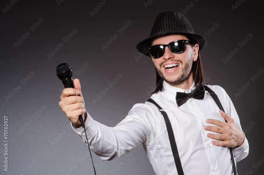 Funny singer with microphone at the concert Funny singer with microphone at the concert