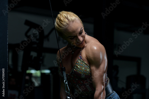 Female Bodybuilder Doing Heavy Weight Exercise For Triceps