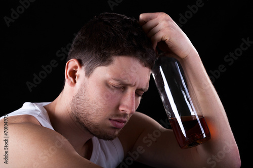 Man with bottle of alcohol